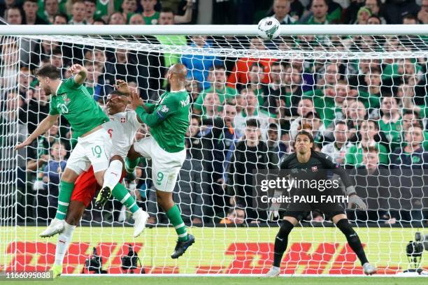 Republic of Ireland's striker David McGoldrick climbs to head home the Irish equalizer during the Euro 2020 football qualification match between...