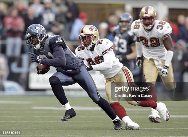 Seattle's wide receiver Peter Warrick gets away from defender Bruce Thornton as he makes a reception in the fourth quarter at Qwest Field in Seattle,...