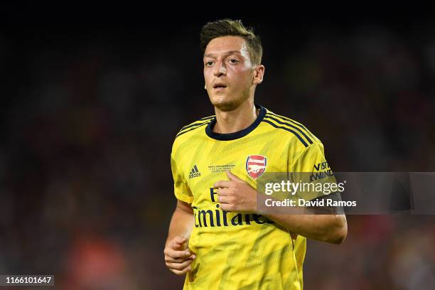 Mesut Ozil of Arsenal looks on during the Joan Gamper trophy friendly match between FC Barcelona and Arsenal at Nou Camp on August 04, 2019 in...