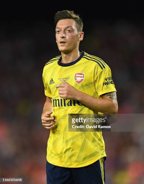 Mesut Ozil of Arsenal looks on during the Joan Gamper trophy friendly match between FC Barcelona and Arsenal at Nou Camp on August 04, 2019 in...