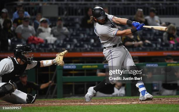 Jorge Alfaro of the Miami Marlins hits a two run RBI single to center field in the eighth inning during the game against the Pittsburgh Pirates at...