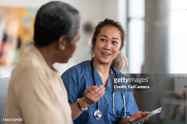 doctor and patient having a conversation - diabetes pills stock pictures, royalty-free photos & images
