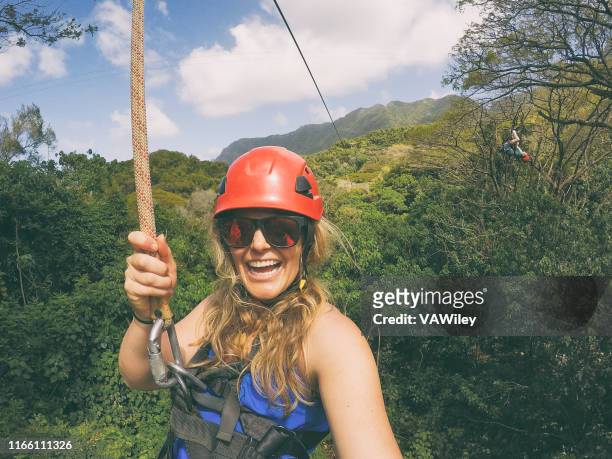 zip lining adventure in the jungle of kauai with mom - kauai stock pictures, royalty-free photos & images