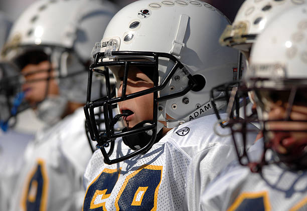 Youth Pee-Wee football players wait to take the field for pre-game exhibition before game between the Arizona Cardinals and San Diego Chargers at...