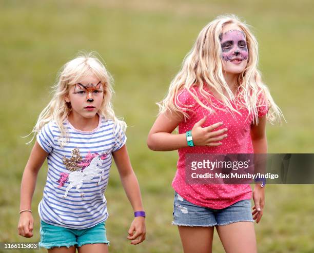 Isla Phillips and Savannah Phillips, seen wearing animal design face paint, attend day 3 of the 2019 Festival of British Eventing at Gatcombe Park on...