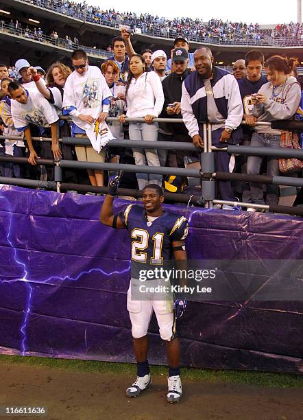 San Diego Chargers running back LaDainian Tomlinson poses with fans after 27-20 victory over the Arizona Cardinals at Qualcomm Stadium in San Diego,...