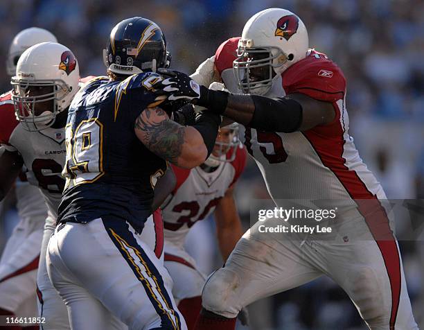 Arizona Cardinals offensive tackle Leonard Davis blocks against Igor Olshansky of the San Diego Chargers during 27-20 loss at Qualcomm Stadium in San...