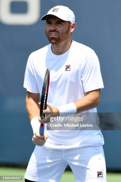Bjorn Fratangelo of the United States prepares for a shot from Ivo Karlovic of Croatia during Day 1 of the Citi Open at Rock Creek Tennis Center on...