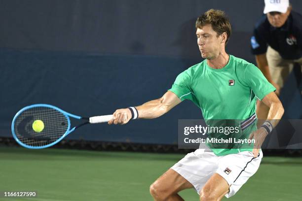 Tim Smyczek of Australia returns a shot from Matthew Ebden of the Australia during Day 1 of the Citi Open at Rock Creek Tennis Center on July 29,...