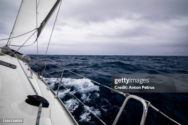 yacht during a storm in dramatic weather - aboard stock pictures, royalty-free photos & images