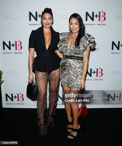 Beauty moguls, Nikki Bella and Brie Bella attend the Nikki and Brie Bella launch of their new product line during fashion week for Nicole and Brizee,...