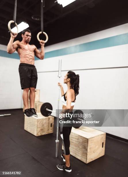Premium Photo  Crossfit fitness dip ring man workout upside down at gym