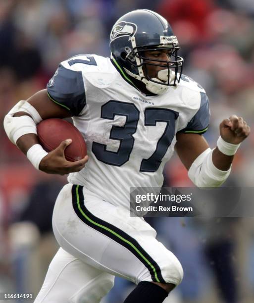Seattle's Shaun Alexander rushes for a first down against Tennessee December 18 at the Coliseum, in Nashville, Tennessee. Seattle defeated Tennessee...