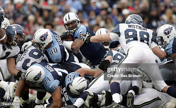 Tennessee's Steve McNair picks up a fourth down on 4th down against Seattle December 18 at the Coliseum, in Nashville, Tennessee. Seattle defeated...