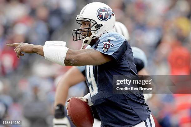 Tennessee's Steve McNair rolls out to pass against Seattle December 18 at the Coliseum, in Nashville, Tennessee. Seattle defeated Tennessee 28-24.