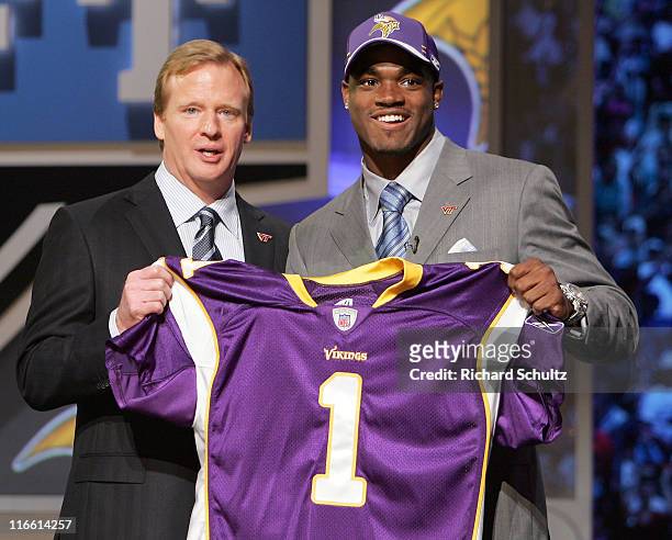 Commissioner Roger Goodell, left, with Adrian Peterson RB out of Oklahoma chosen seventh by the Minnesota Vikings during the NFL draft at Radio City...