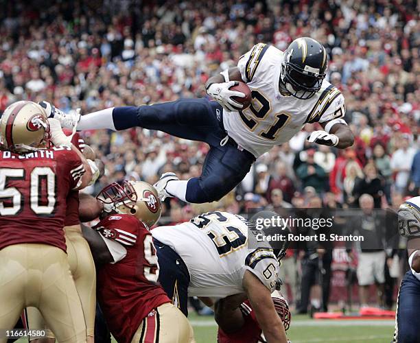 Chargers running back LaDainian Tomlinson scores his third touchdown of the day with a 1-yard leap into the endzone late in the second quarter as the...