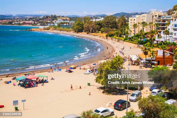 curved cristo beach from high angle in estepona - estepona stock pictures, royalty-free photos & images