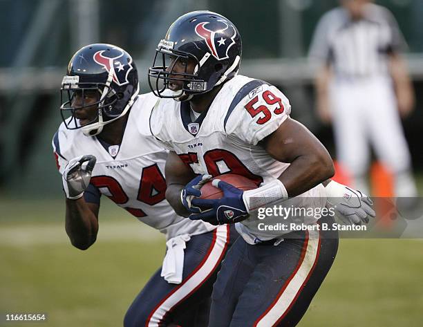 Houston rookie middle linebacker DeMeco Ryans returns an interception in the final seconds of the game as the Houston Texans defeated the Oakland...