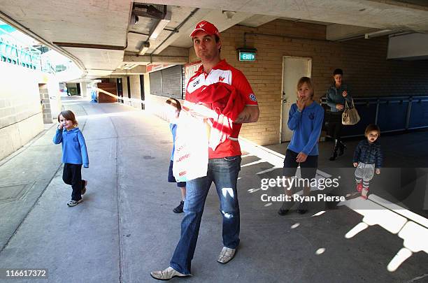 Daniel Bradshaw of the Sydney Swans and his family walk around the SCG after a press conference to announce his retirement from the AFL at Sydney...