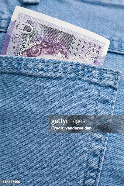 pocket money - twenty pound note stock pictures, royalty-free photos & images