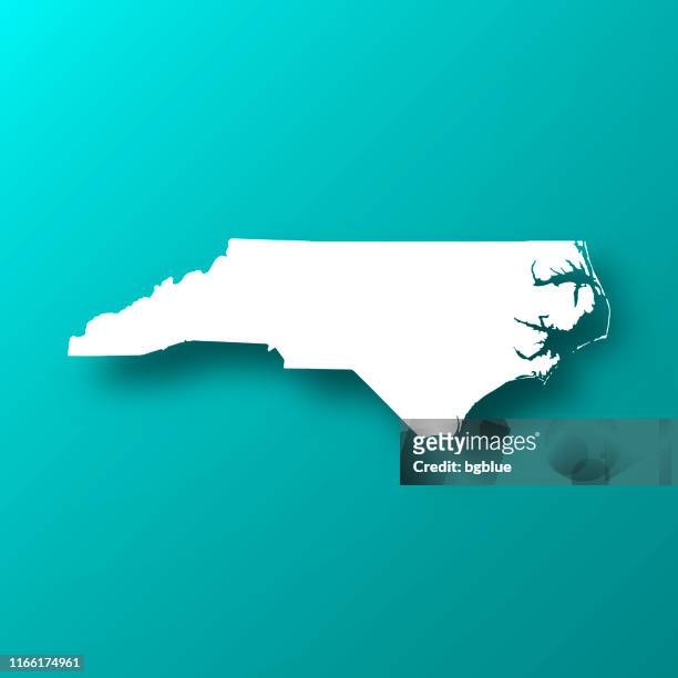 north carolina map on blue green background with shadow - north carolina us state stock illustrations