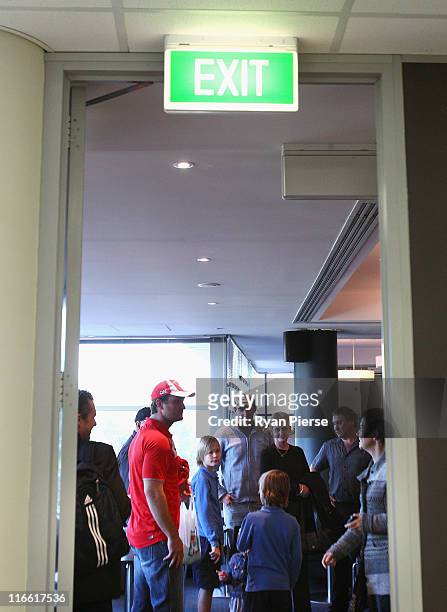 Daniel Bradshaw of the Sydney Swans speaks to his family after a press conference to announce his retirement from the AFL at Sydney Cricket Ground on...