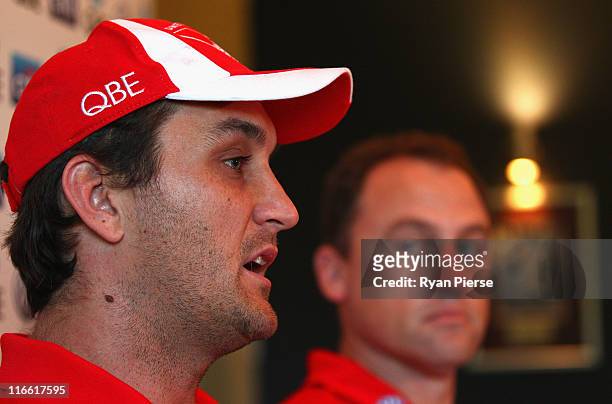 Daniel Bradshaw of the Sydney Swans and speaks to the media during a press conference to announce his retirement from the AFL as John Longmire, coach...