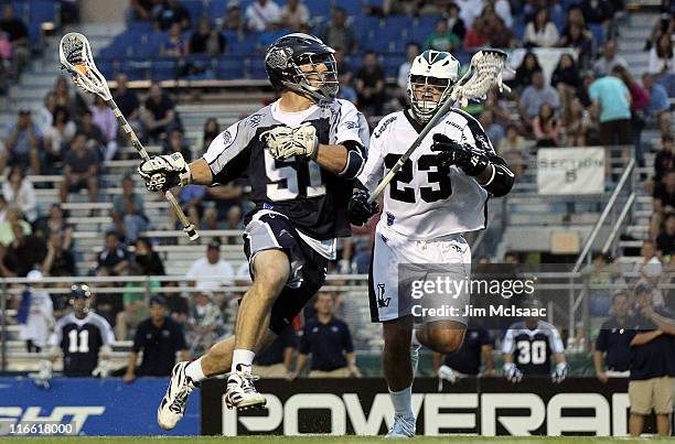 Mike Kimmel of the Chesapeake Bayhawks controls the ball against Mike Ward of the Long Island Lizards during their Major League Lacrosse game on June...