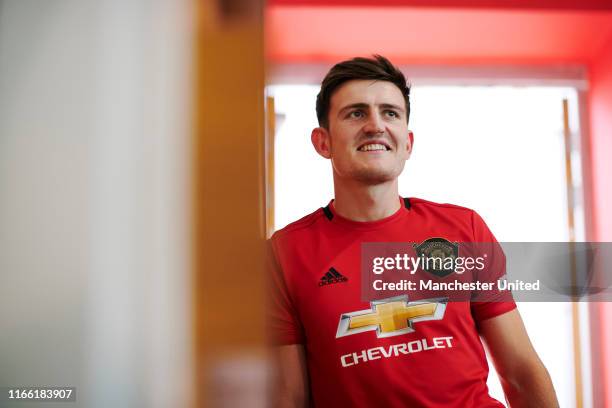 Harry Maguire of Manchester United walks around the Aon Training Complex after signing for the club at Aon Training Complex on August 04, 2019 in...