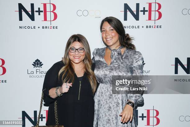 Ashlee White and Heather Grabin attend the Beauty moguls, Nikki and Brie Bella launch of their new product line during fashion week for Nicole and...