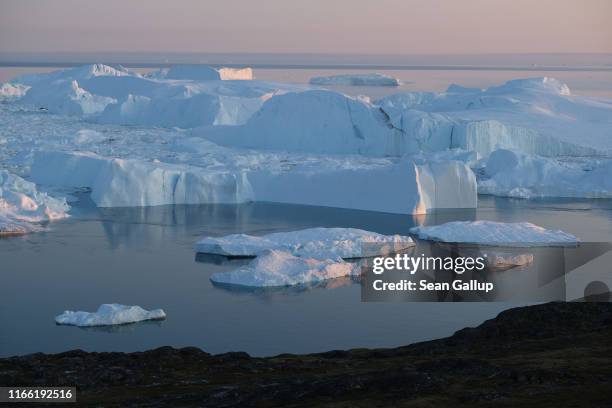 Icebergs and ice float in the Ilulissat Icefjord on August 04, 2019 near Ilulissat, Greenland. The Sahara heat wave that recently sent temperatures...