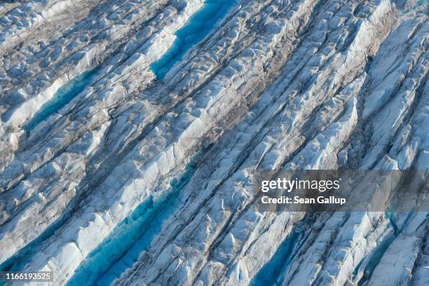 In this view from an airplane ice forms a ridged landscape on the Sermeq Kujalleq glacier, also called the Jakobshavn glacier, on August 04, 2019...