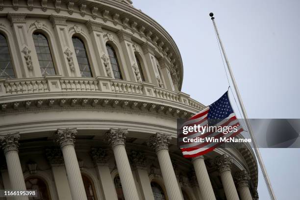 The American flag flies at half staff over the U.S. Capitol in memory of those killed in the recent mass shootings in El Paso, Texas and Dayton, Ohio...