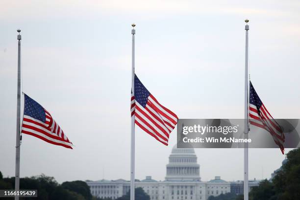 The American flag flies at half staff over the U.S. Capitol in memory of those killed in the recent mass shootings in El Paso, Texas and Dayton, Ohio...