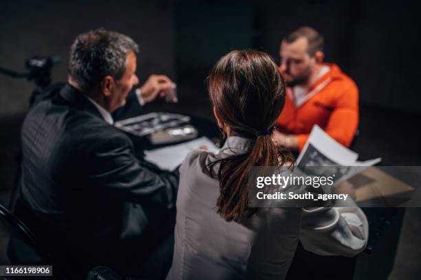 two detectives interrogating a prisoner - probation stock pictures, royalty-free photos & images