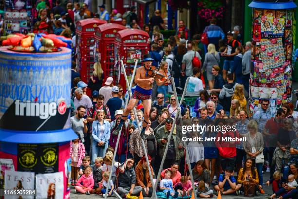 Edinburgh Festival Fringe entertainers perform on the Royal Mile on August 5, 2019 in Edinburgh, Scotland. The festival takes place in the Scottish...