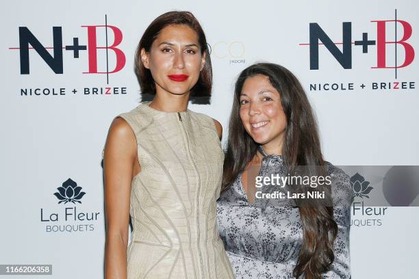 Diana Garcia and Heather Grabin attend the Beauty moguls, Nikki and Brie Bella launch of their new product line during fashion week for Nicole and...