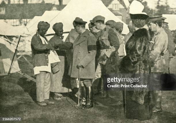 King George and Queen Mary visit wounded soldiers, First World War . 'Wounded Heroes from the Front: Their Majesties visiting one of the Indian...