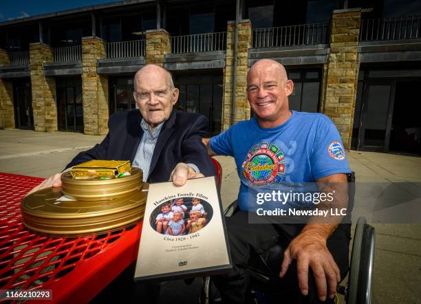 Ed Hawkins and his son Peter outside the Jones Beach East Bathhouse in Wantagh, New York, on July 24, 2019. Ed Hawkins holds some of the film shot by...