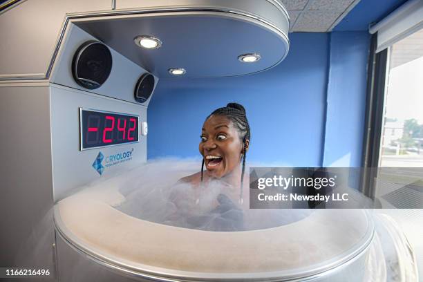 Kianne Muschett of North Babylon, New York reacts as she undergoes Whole Body Cryotherapy at Cryology in Babylon, New York on July 10, 2019.