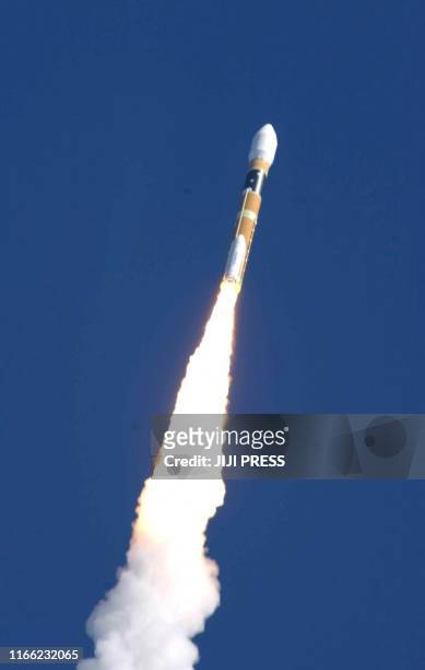 Japan's state-of-the-art H-2A rocket carrying an Australian satellite lifts off from the Tanegashima Space Center of the National Space Development...