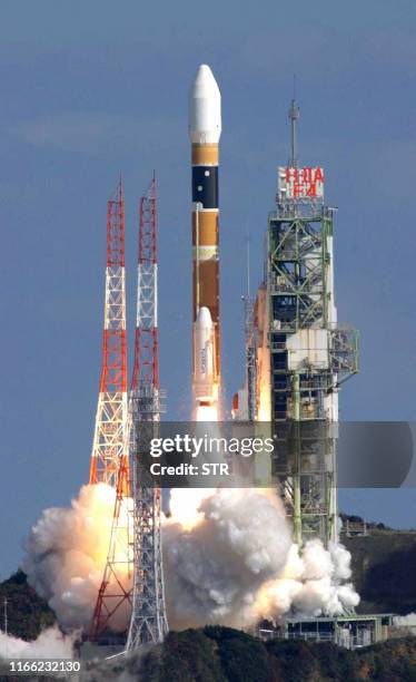 Japan's state-of-the-art H-2A rocket carrying an Australian satellite lifts off from the Tanegashima Space Center of the National Space Development...