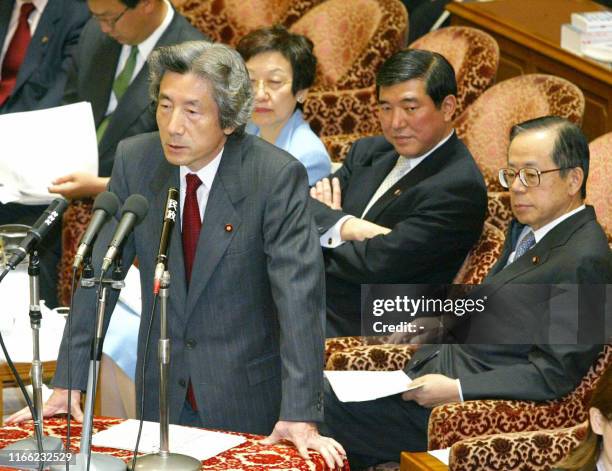 Japanese Prime Minister Junichiro Koizumi answers a question during a House of Representatives committee session at the Diet in Tokyo, 14 May 2003....