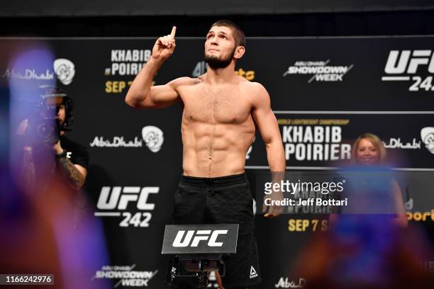 Khabib Nurmagomedov of Russia poses on the scale during the UFC 242 weigh-in at The Arena on September 6, 2019 in Abu Dhabi, United Arab Emirates.