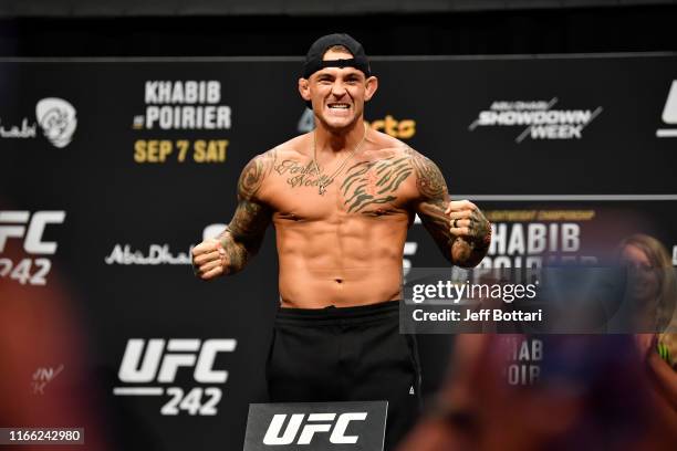 Dustin Poirier poses on the scale during the UFC 242 weigh-in at The Arena on September 6, 2019 in Abu Dhabi, United Arab Emirates.