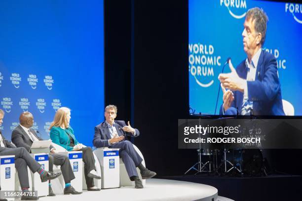 , Sipho Pityana, Chairman of AngloGold Ashanti, South Africa, Ellen Agler, Chief Executive Officer of The END Fund, USA, listen to Andre Hoffmann,...
