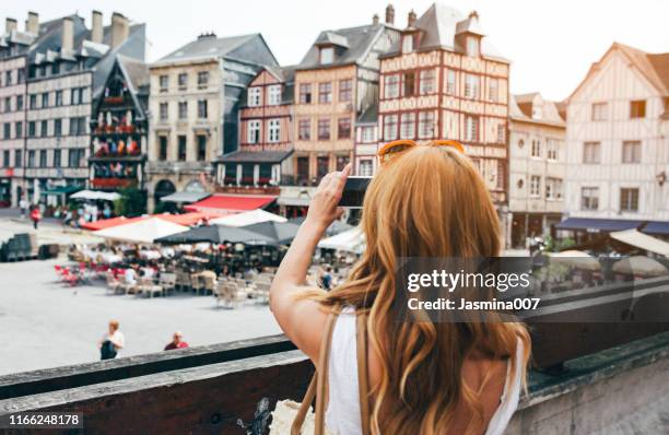 young woman take photos in rouen - tour france stock pictures, royalty-free photos & images