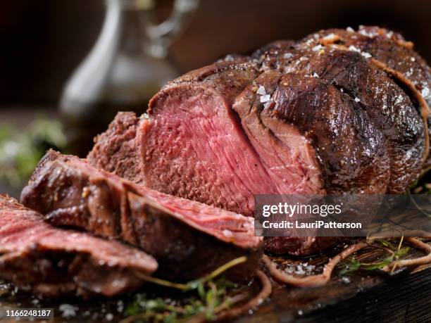 venison, elk sirloin tip roast - juicy stock pictures, royalty-free photos & images