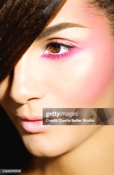 brunette mixed race beauty with pink make-up - sombra rosa fotografías e imágenes de stock